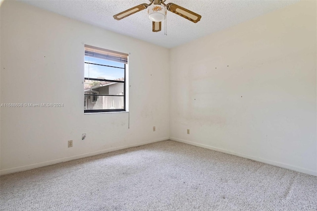 spare room featuring ceiling fan, a textured ceiling, and hardwood / wood-style flooring