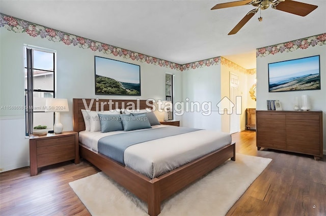 bedroom with ceiling fan and hardwood / wood-style flooring