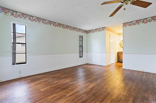 unfurnished room with ceiling fan, a textured ceiling, and wood-type flooring