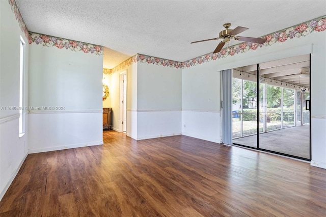 unfurnished room with ceiling fan, a textured ceiling, and hardwood / wood-style flooring