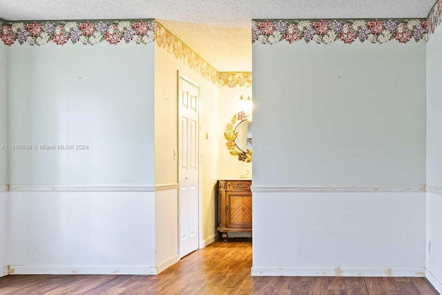 interior space with hardwood / wood-style floors and a textured ceiling