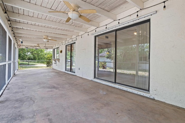 exterior space with ceiling fan