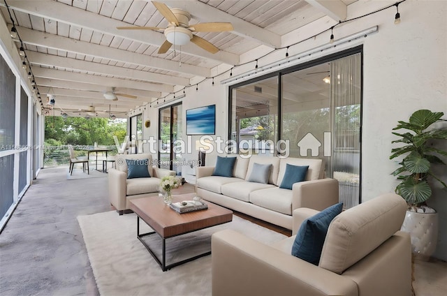 sunroom / solarium featuring ceiling fan, beam ceiling, and wood ceiling