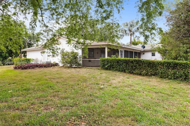 view of yard featuring a sunroom