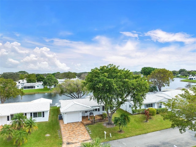 birds eye view of property with a water view