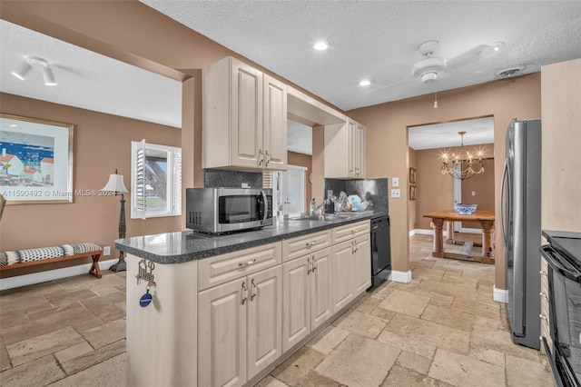 kitchen with light tile patterned flooring, a textured ceiling, and black appliances