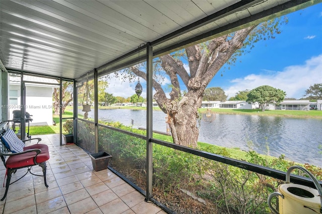 sunroom with a water view