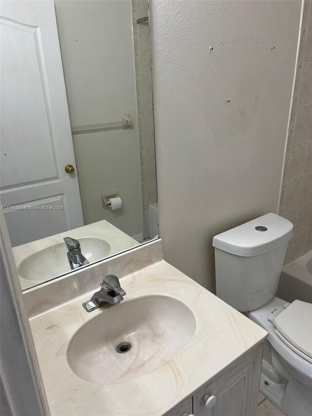 bathroom with vanity and toilet