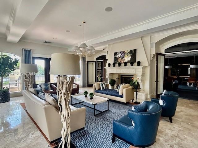 living room featuring a notable chandelier, tile flooring, and ornamental molding