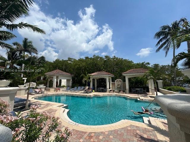 view of pool with a patio area and a gazebo