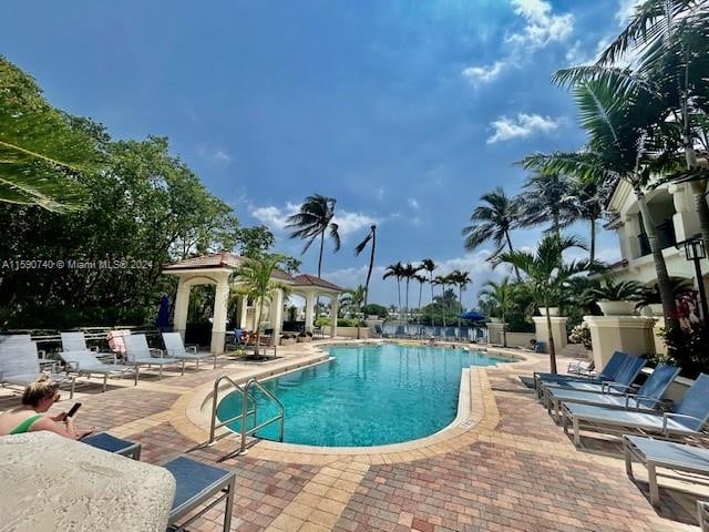 view of pool with a patio and a gazebo