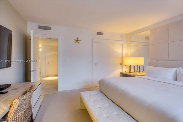 bedroom with a closet and light wood-type flooring