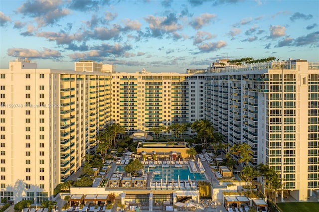 view of building exterior with a community pool