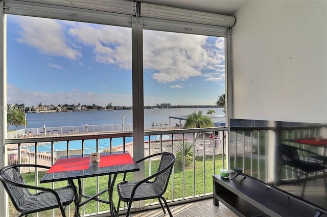 balcony featuring a water view