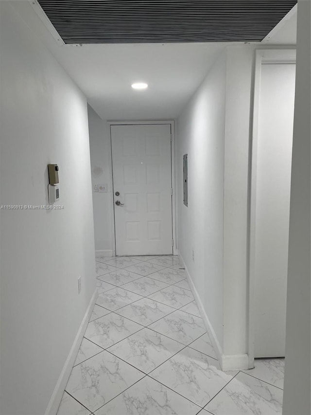 hallway with light tile flooring