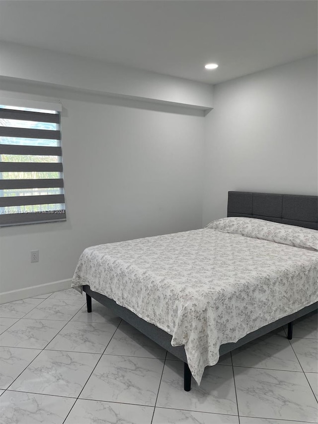 bedroom featuring tile floors