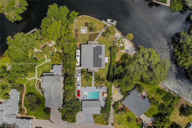 birds eye view of property with a water view