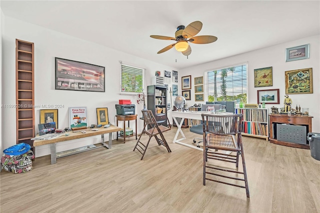 office area with ceiling fan and light hardwood / wood-style floors