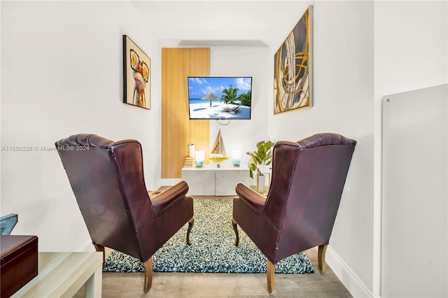 sitting room with hardwood / wood-style floors