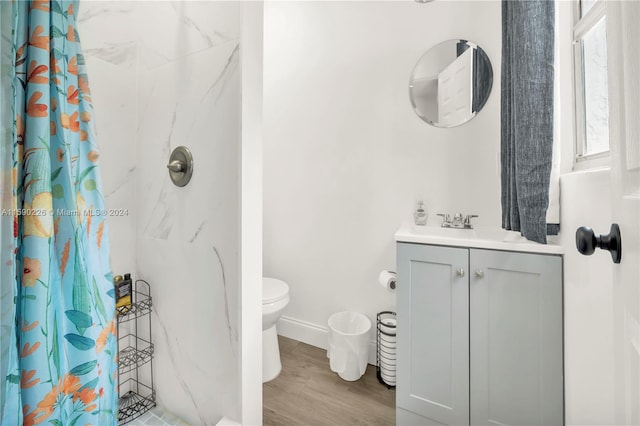 bathroom with a shower with shower curtain, vanity, toilet, and wood-type flooring