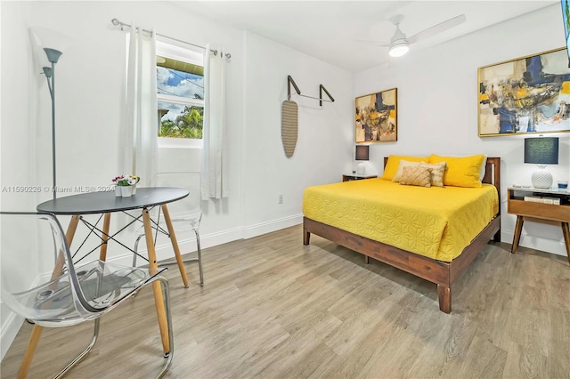 bedroom featuring ceiling fan and light wood-type flooring