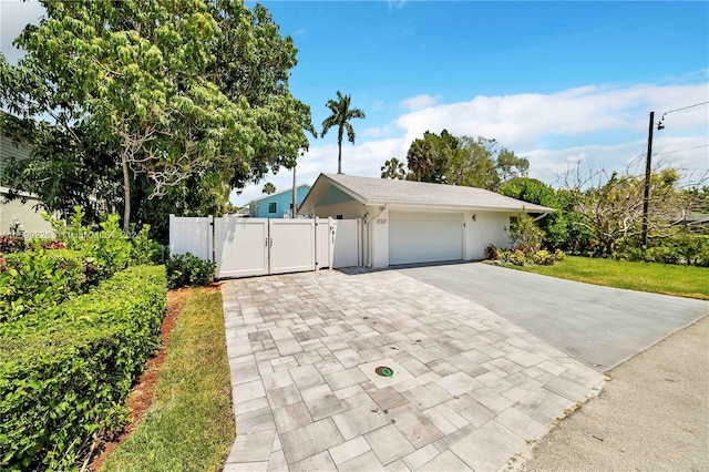 single story home featuring a garage