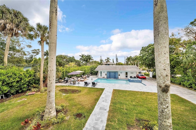 exterior space with a patio area and a yard