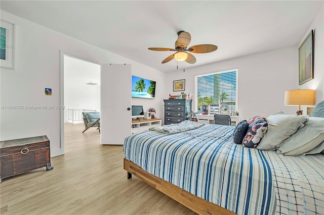 bedroom with ceiling fan and light hardwood / wood-style floors