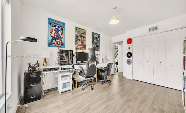 office with light hardwood / wood-style flooring