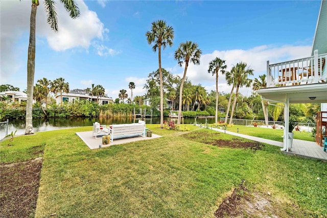 view of yard with a patio and a water view