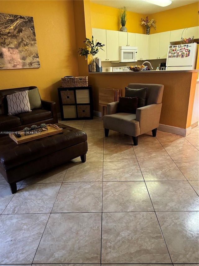 living room featuring light tile patterned flooring