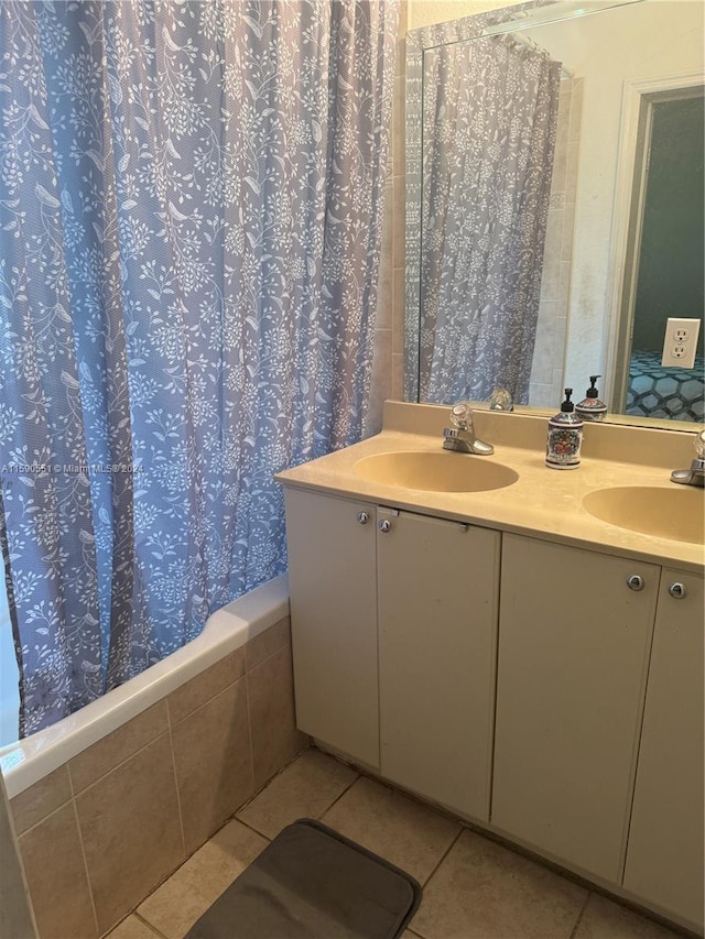 bathroom featuring tile patterned floors and double vanity