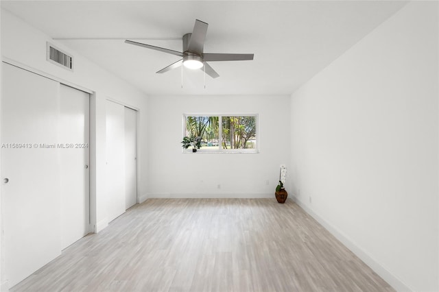 unfurnished bedroom featuring ceiling fan and light hardwood / wood-style flooring