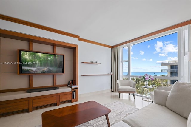 tiled living room with a water view and ornamental molding