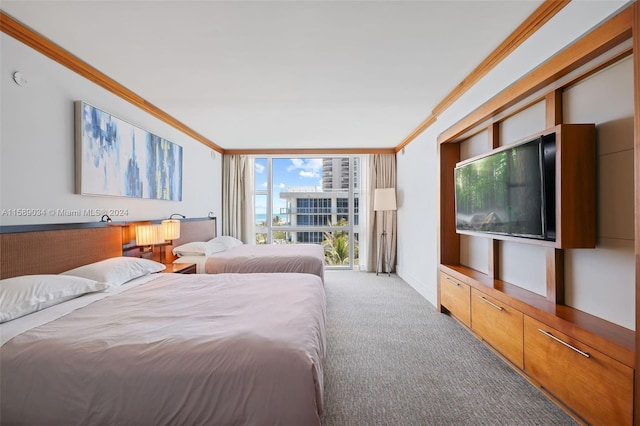 carpeted bedroom featuring ornamental molding