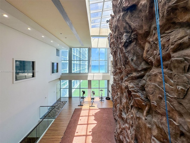 hall with hardwood / wood-style floors