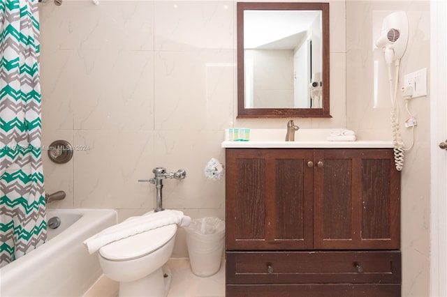 full bathroom with shower / bath combination with curtain, vanity, toilet, and tile walls