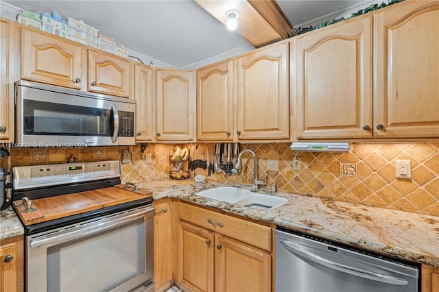 kitchen featuring light stone countertops, stainless steel appliances, backsplash, sink, and light brown cabinetry