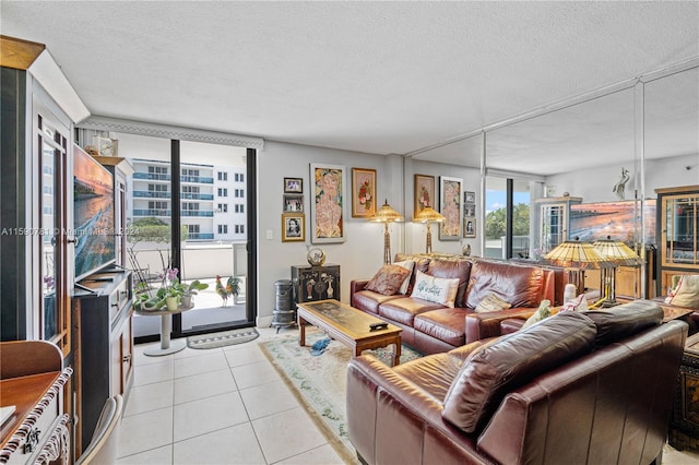 living room featuring a textured ceiling and light tile flooring