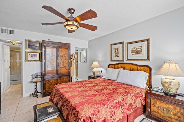 tiled bedroom featuring ceiling fan