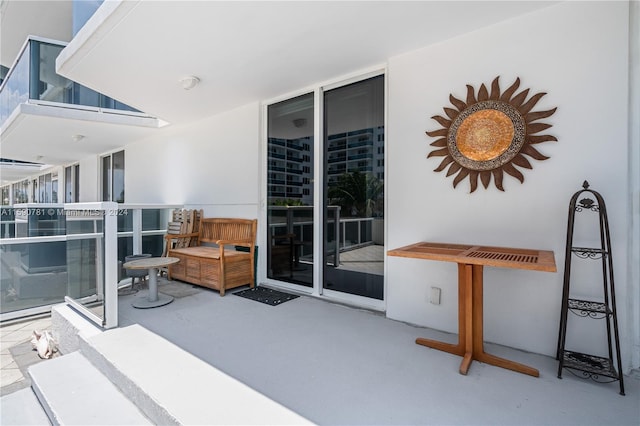 view of patio featuring a balcony