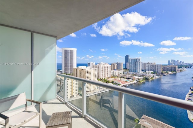 balcony featuring a water view