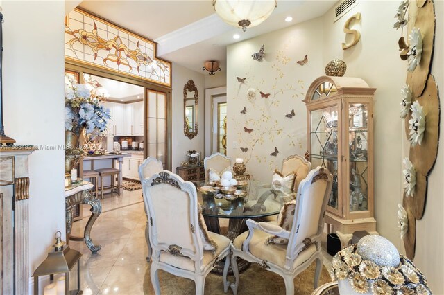 dining space featuring light tile floors