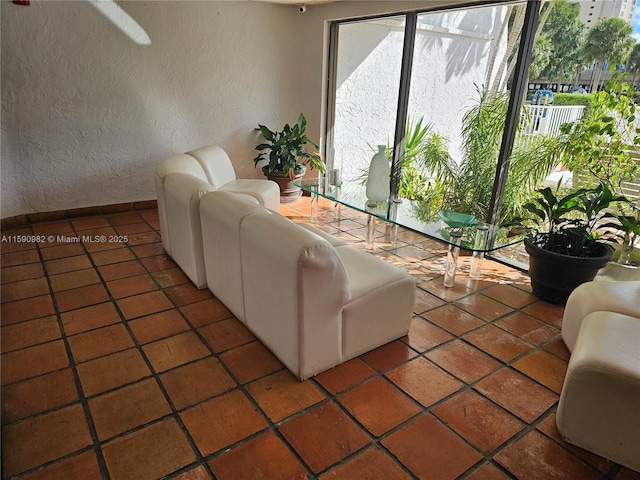 living room with tile patterned flooring