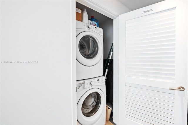 laundry room with stacked washer and clothes dryer