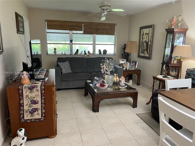 living room with ceiling fan and light tile flooring