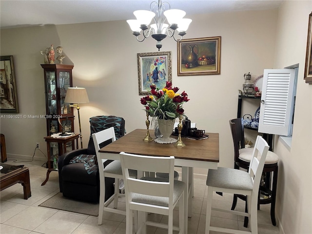 dining room with a notable chandelier and light tile flooring