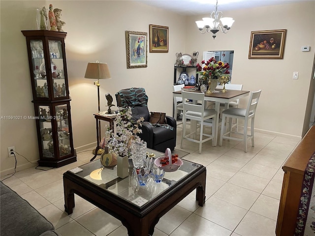 living room featuring a chandelier and light tile floors