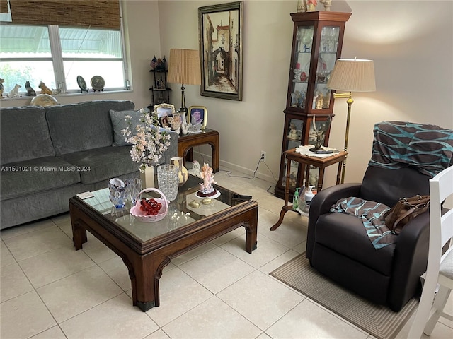 living room featuring light tile floors