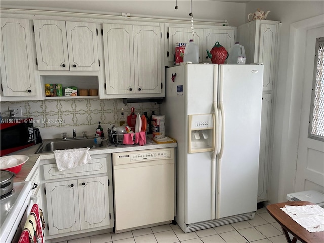 kitchen with white appliances, light tile floors, and tasteful backsplash